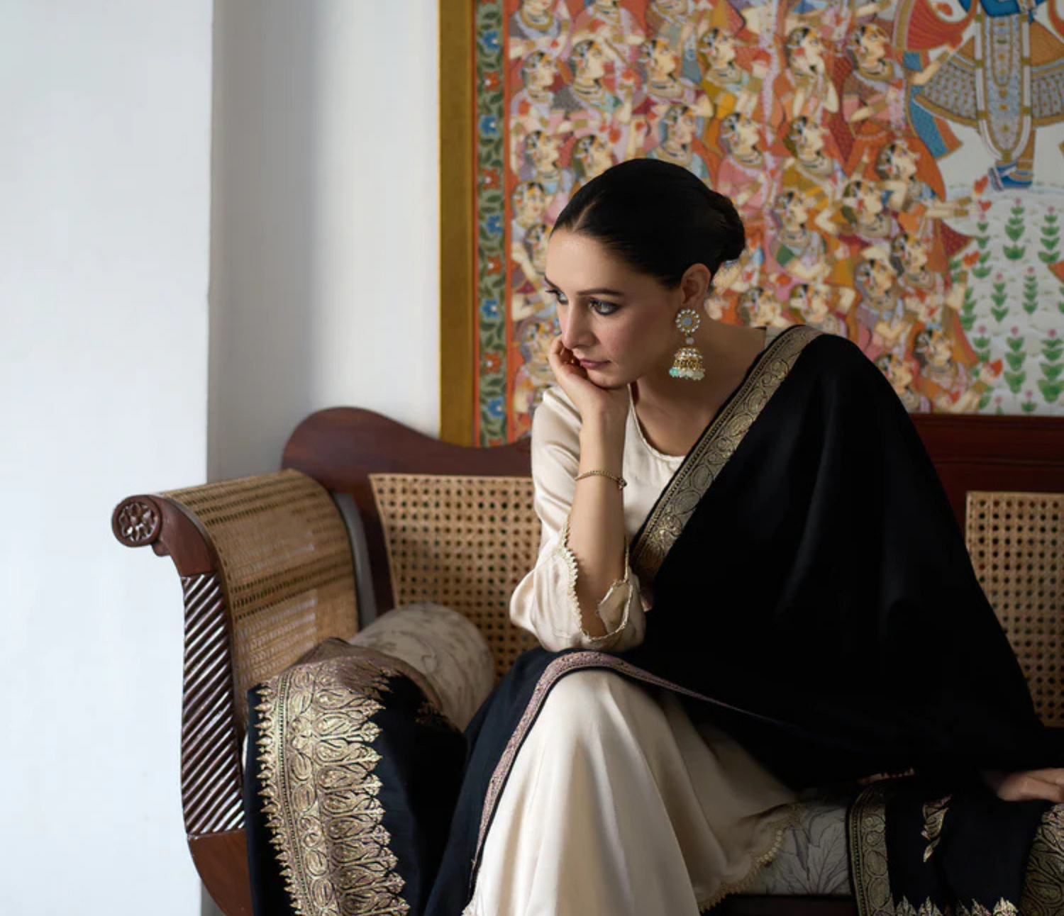 A model featuring Hand Tilla Embroidered Cashmere Pashmina 